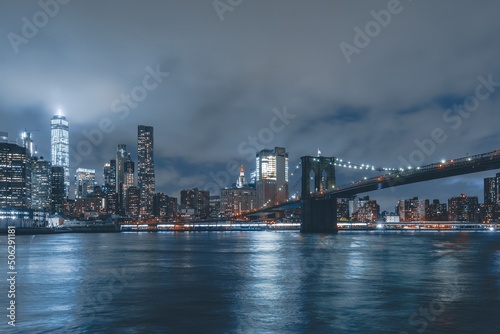 Brooklyn Bridge at Night with Water Reflection in New York City © sleg21