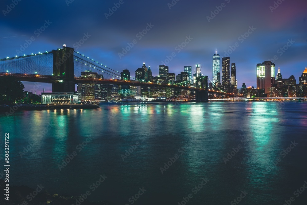 Brooklyn Bridge at Night with Water Reflection in New York City