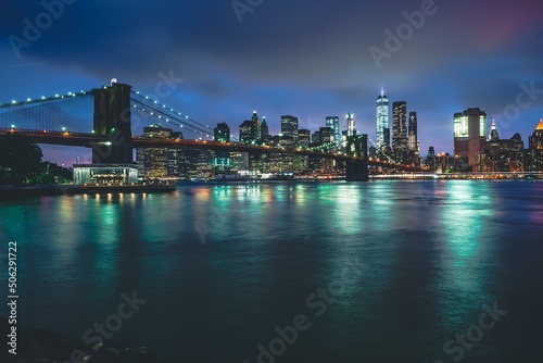 Brooklyn Bridge at Night with Water Reflection in New York City