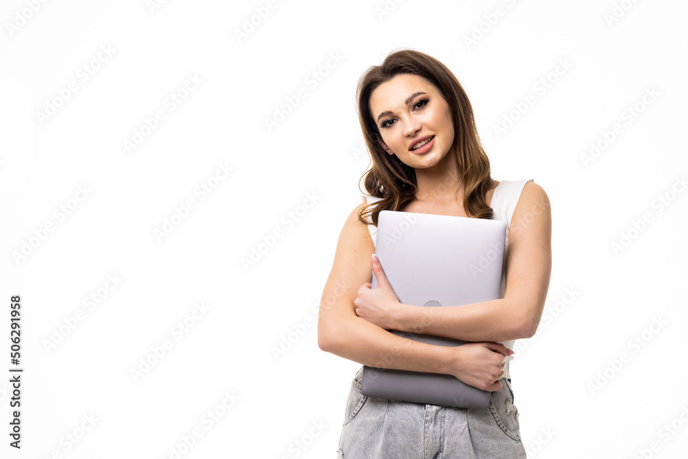 Portrait of young office woman, entrepreneur answer clients on laptop standing over white background Portrait of young office woman, entrepreneur answer clients on laptop standing over white background