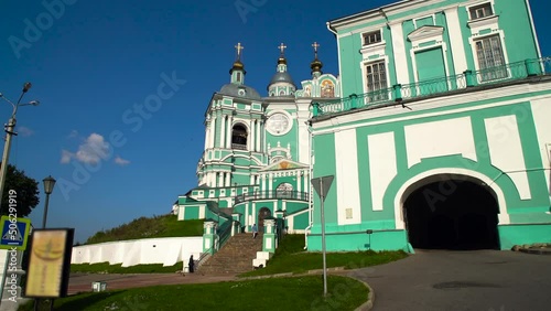 The church on the hill. People are walking up the stairs. photo