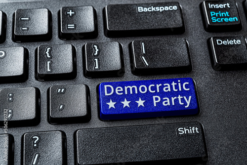 Democratic Party blue key on a decktop pc keyboard. United States elections and politics concepts. Voting online for Democratic party. Democratic Party word message on a laptop enter key. photo