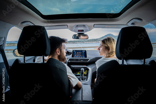 couple driving in beautiful cityscape