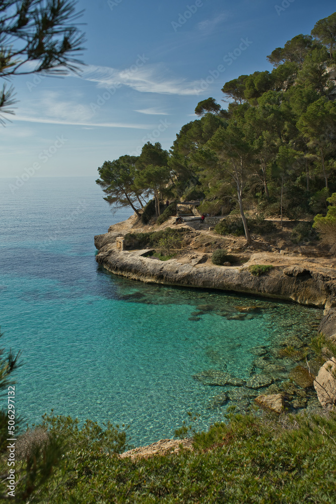 Panoramic view of Cala Mitjana on a sunny day from the Cami de Cavalls route on the island of Menorca, Balearic Islands, Spain.