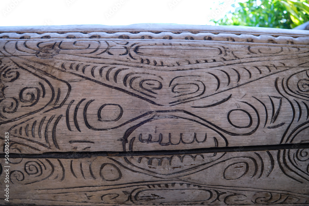 A wooden trunk with artistic engravings of Polynesian motifs A wooden trunk with artistic engravings of Polynesian motifs