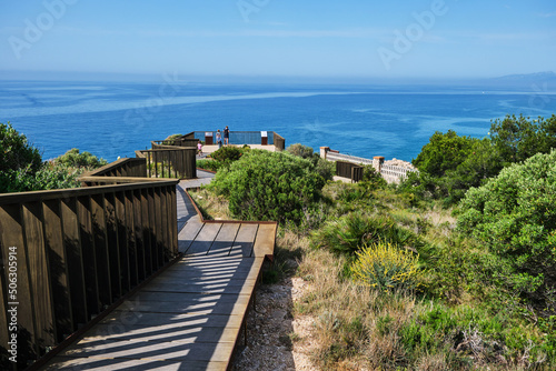Viewpoints and walkways to look at the sea from the top of a balcony, on a sunny summer day.