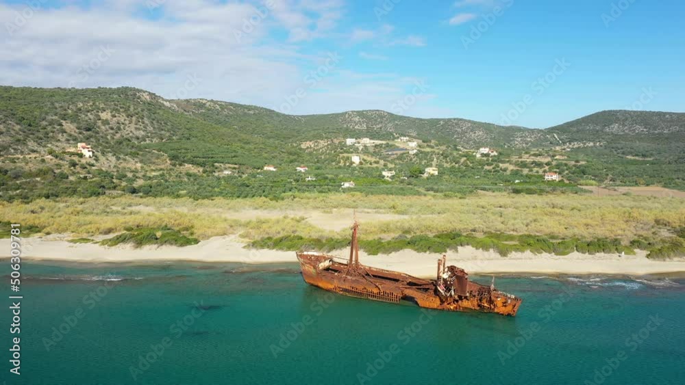 The Dimitrios Wreck by the Ionian Sea facing the countryside in Europe, Greece, the Peloponnese, Mani, towards Gythio, in summer, on a sunny day. The Dimitrios Wreck by the Ionian Sea facing the countryside in Europe, Greece, the Peloponnese, Mani, towards Gythio, in summer, on a sunny day.