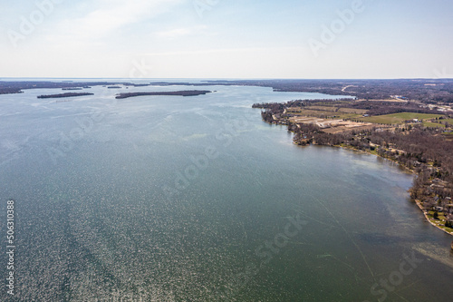 Cumberland beach amigo beach water drone view islands in Ontario Canada summer time blue skies 