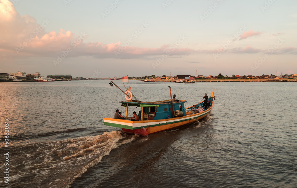 A boat sailing on Kapuas River, Pontianak