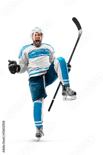 Athlete in action. Very emotional hockey player with stick and puck in his hands. Sports emotions. Hockey athlete with desire to win and be champion