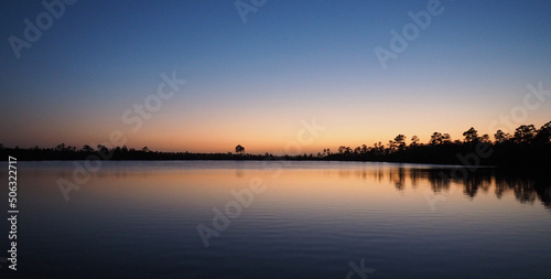 Twilight over Pine Glades Lake in Everglades National Park, Florida on calm clear April evening.