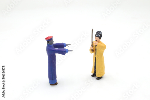 Картината върху платно a scale of figure Taoist priest with zombie
