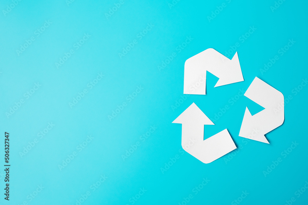 Paper Recycle logo cutout on blue background. Environmental Protection, Zero waste, Reusable, Say No Plastic, World Environment day, Ecology day and Earth day concept Paper Recycle logo cutout on blue background. Environmental Protection, Zero waste, Reusable, Say No Plastic, World Environment day, Ecology day and Earth day concept