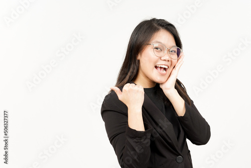Presenting and Pointing Side Product Using Thumb Of Beautiful Asian Woman Wearing Black Blazer