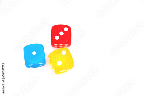 Colored dice in overhead shot isolated on a white background photo