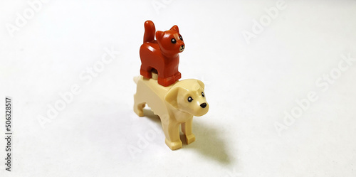 The cat on the dog miniature toy animal friendship