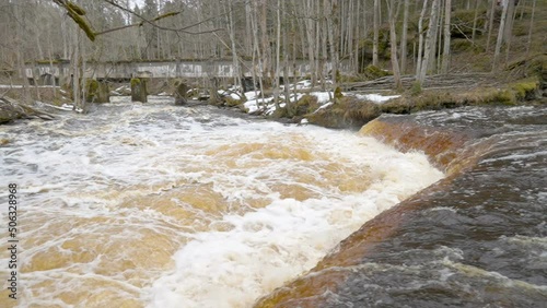 The trees around the Nommeveski waterfalls in Lahemaa National Park in Estonia as seen on a landscape view photo