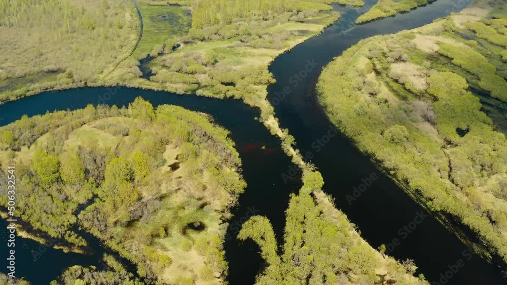 Aerial View Green Forest Woods And Curved River Landscape In Spring Day. Drone Flight View. Bird's Eye View. Aerial View Green Forest Woods And Curved River Landscape In Spring Day. Drone Flight View. Bird's Eye View.