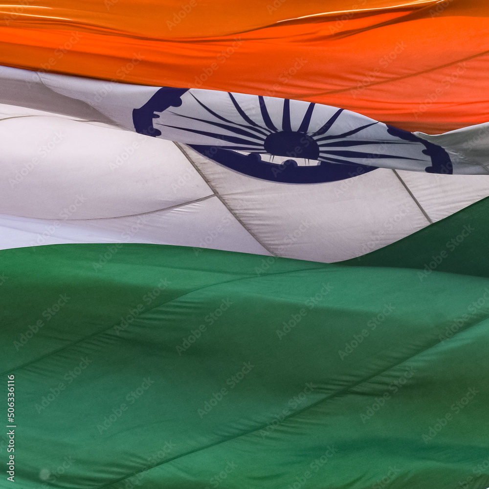 India flag flying high at Connaught Place with pride in blue sky, India
