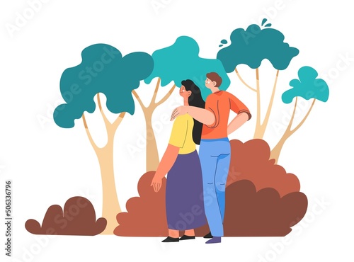 Couple strolling in woods, forest or park walking