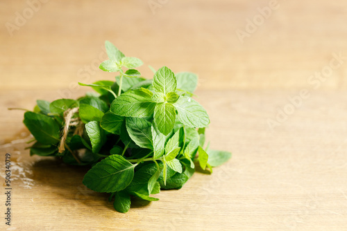 Fresh mint on wooden table.