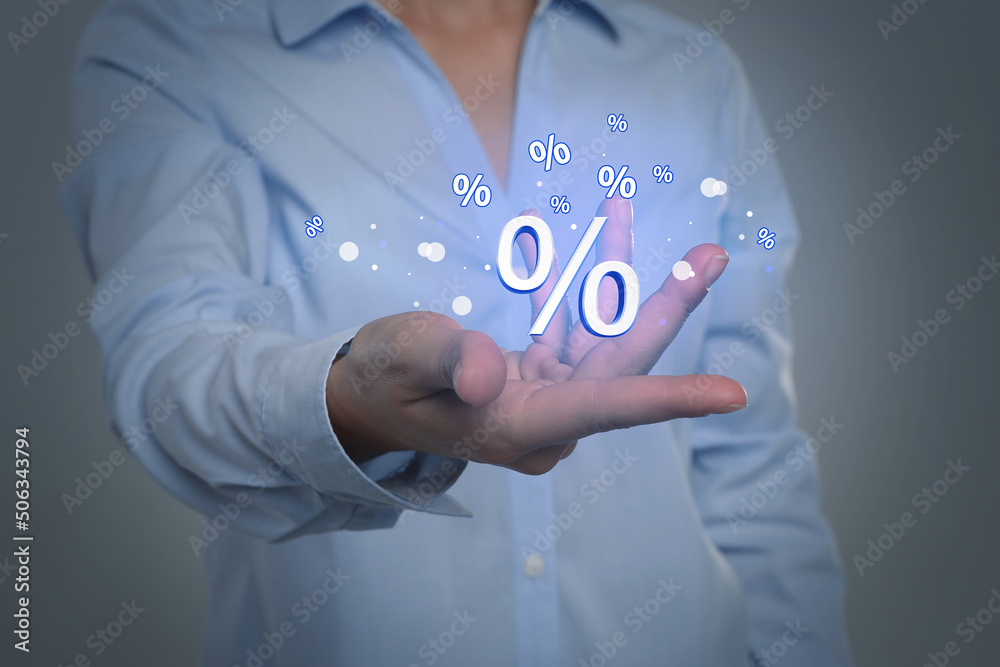 Woman showing virtual percent sign on light grey background, closeup. Discount concept