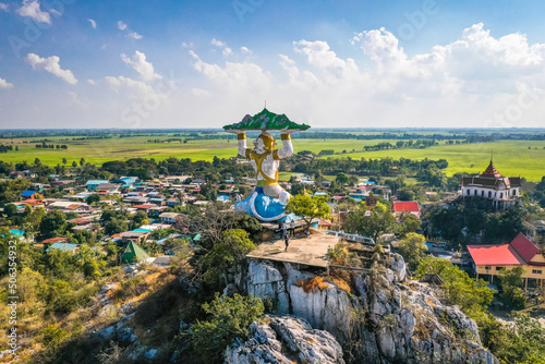Aerial view of Wat Khao Samo Khon temple, with hanuman monkey god statue on top of mountain, in Lopburi, Thailand
