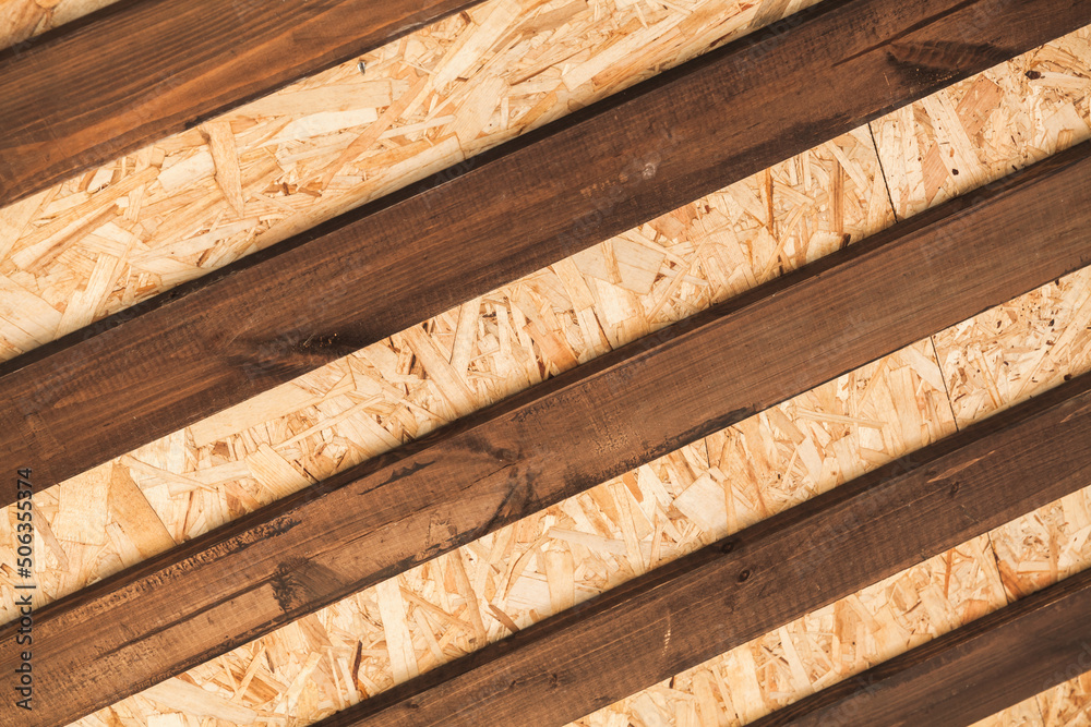 Internal details of wooden roof, framework of brown boards