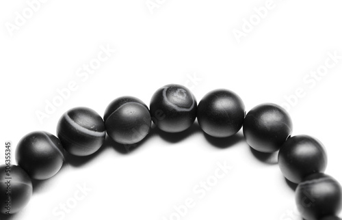 Bracelet of round black agate beads isolated on white background