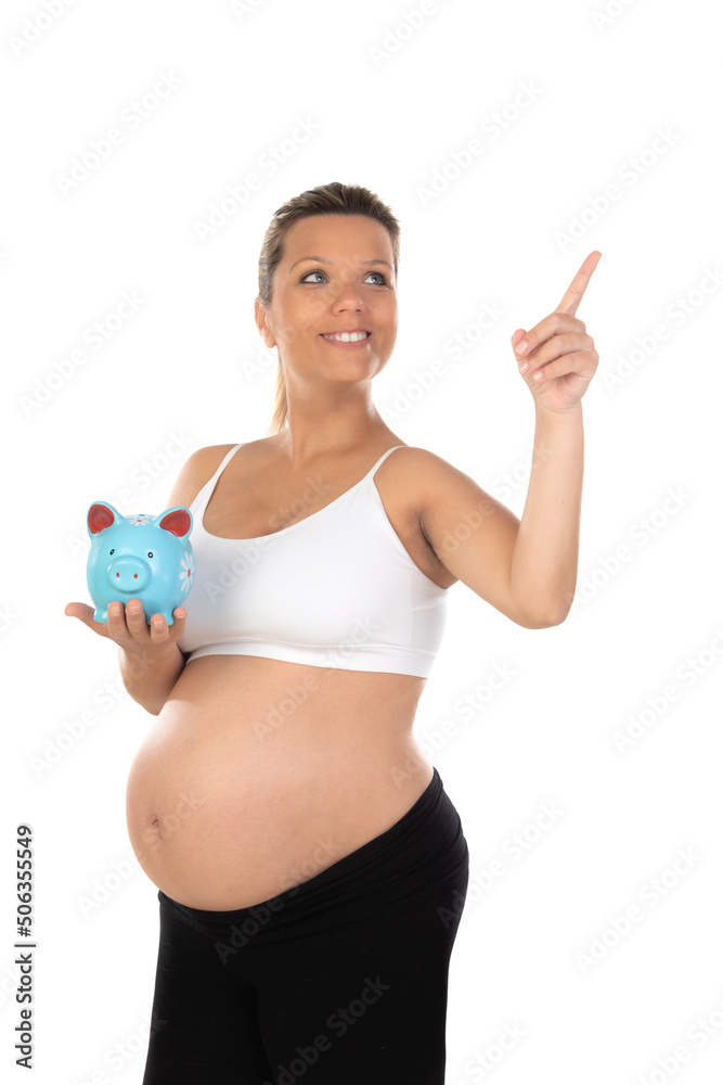 Beautiful smiling woman waiting for baby holding a moneybox Beautiful smiling woman waiting for baby holding a moneybox