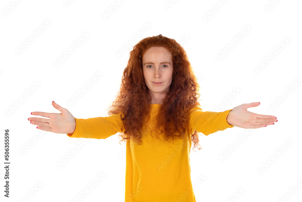 Friendly redhead girl in yellow t-shirt extend arms sideways Friendly redhead girl in yellow t-shirt extend arms sideways