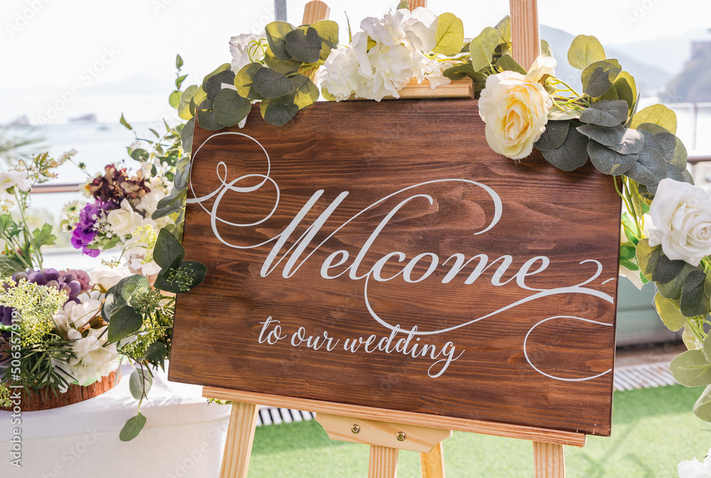 wedding reception counter with a wooden sign writing 