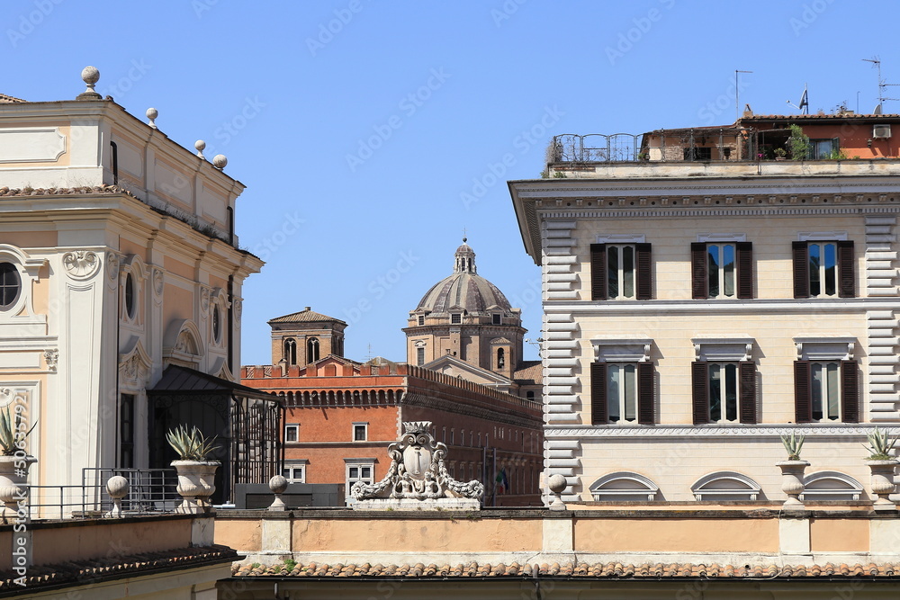 View with Building Facades, Church Dome and Sculpted Details in Rome, Italy