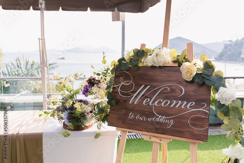 wedding reception counter with a wooden sign writing 