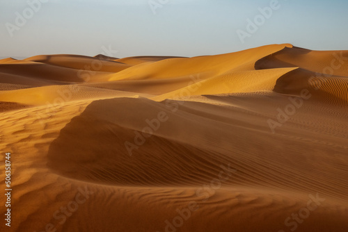 Print op canvas Sand blowing over sand dunes in wind, Sahara desert