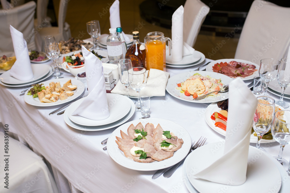 served festive table in a restaurant, close-up served festive table in a restaurant, close-up