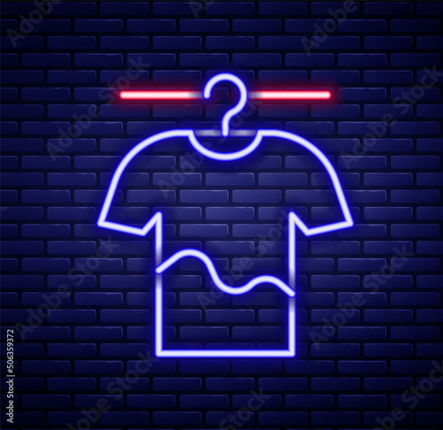 Glowing neon line Drying clothes icon isolated on brick wall background. Clean shirt. Wash clothes on a rope with clothespins. Clothing care and tidiness. Colorful outline concept. Vector