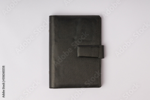 black leather hardcover diary isolated on white background