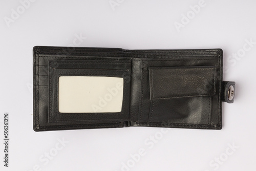 empty open black leather wallet on white background