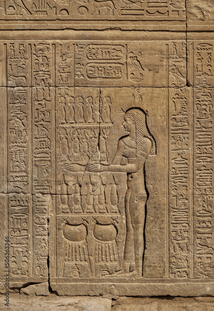 Hieroglyphic carvings on the exterior walls of an ancient egyptian temple Hieroglyphic carvings on the exterior walls of an ancient egyptian temple