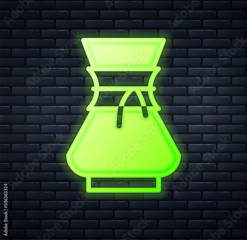 Glowing neon Pour over coffee maker icon isolated on brick wall background. Alternative methods of brewing coffee. Coffee culture. Vector