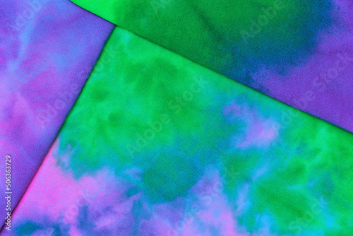Abstract tie dye neon multicolor folded fabric cloth boho pattern texture for background, sale flyer, 60s, 70s, 80s, 90s retro poster, tie-dye diy backdrop. Modern Watercolor wapor wave, Fabrics Art photo