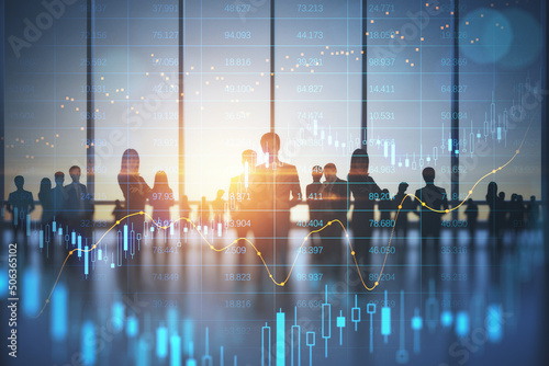 Stock market business and trading concept with digital screen with financial chart graphs and candlestick and group of people in office at sunset, double exposure