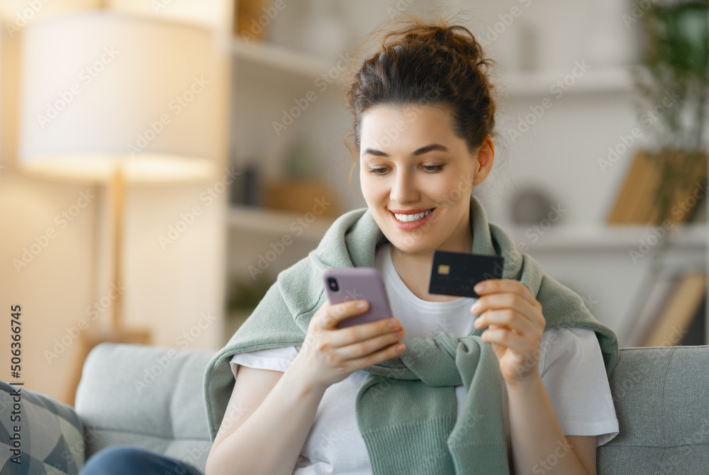 Woman is doing online purchases Woman is doing online purchases