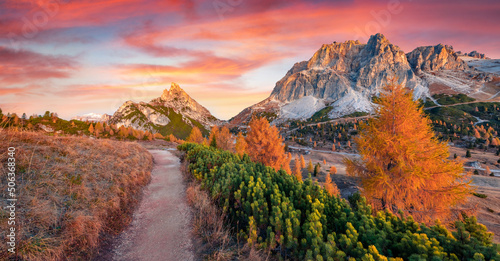 Falzarego pass with Forcella and Sass de Stria peaks on background. Fabulous autumn scene Dolomite Alps, Cortina d'Ampezzo lacattion, Italy, Europe. Beauty of nature concept background.. photo