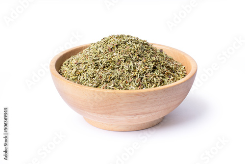 Dried Thyme leaf in wooden bowl isolated on white background.