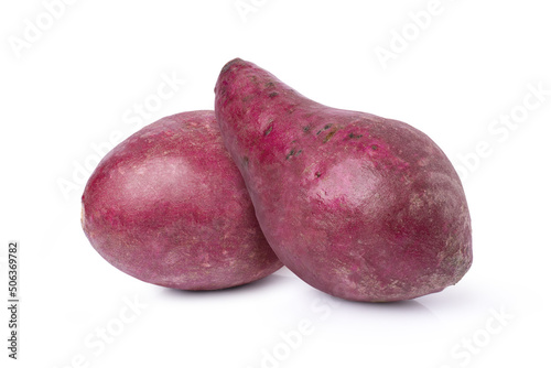 Purple sweet potatoes with slices isolated on white background. 