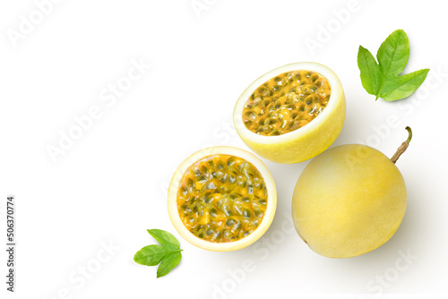 yellow Passion fruit (passionfruit) with water droplets and green leaves isolated on white background. photo