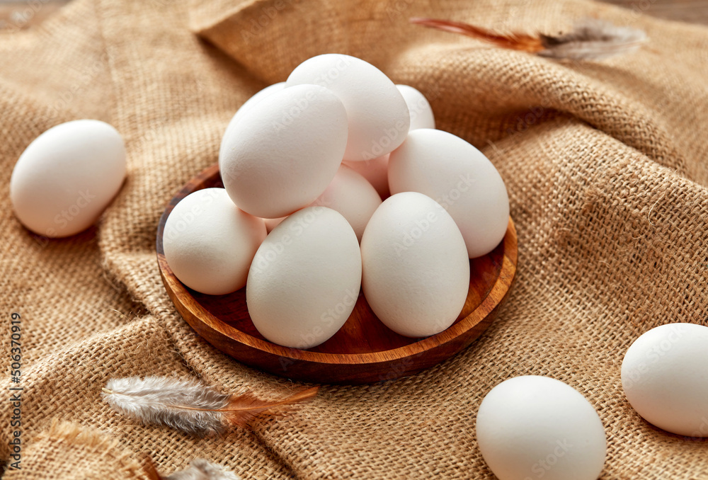 Farm eggs and burlap background Farm eggs and burlap background
