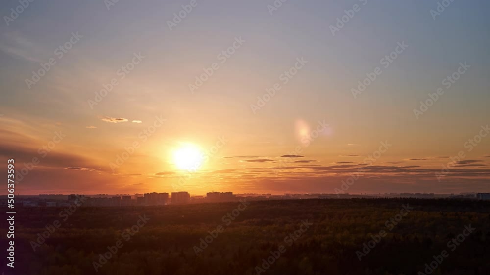Sunset among the evening clouds. Red sun in the evening sky, timelapse Sunset among the evening clouds. Red sun in the evening sky, timelapse